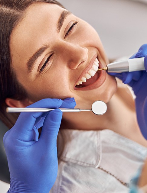 Woman having her teeth cleaned